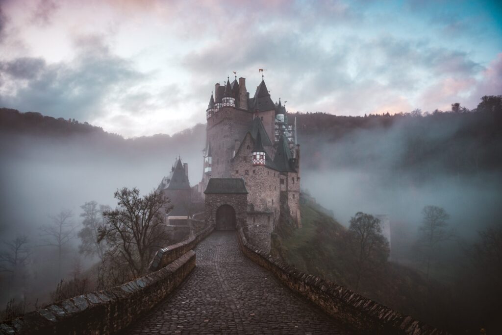 A castle on a misty mountainside. Definitely some kind of wizard school if you ask me.