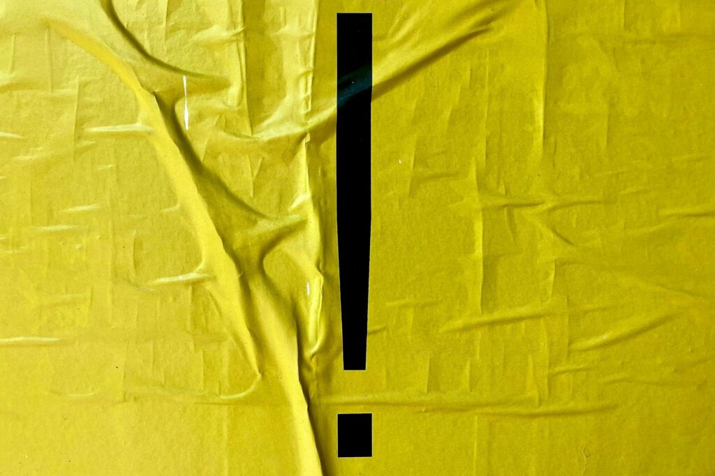 Exclamation mark on yellow material