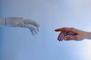 robot hand reaching out to human hand